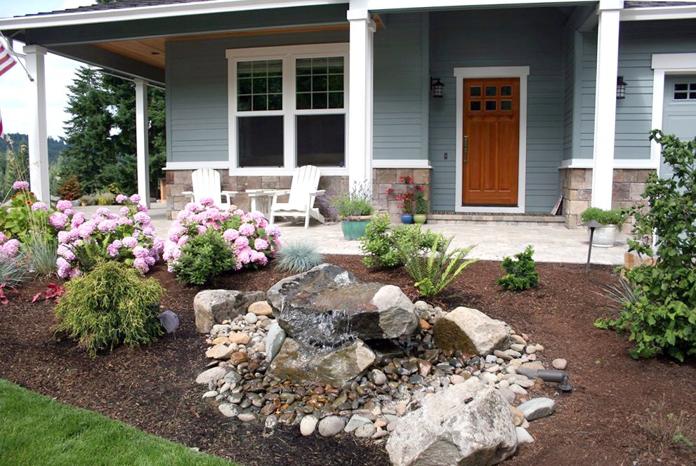 home exterior with plants on front porch